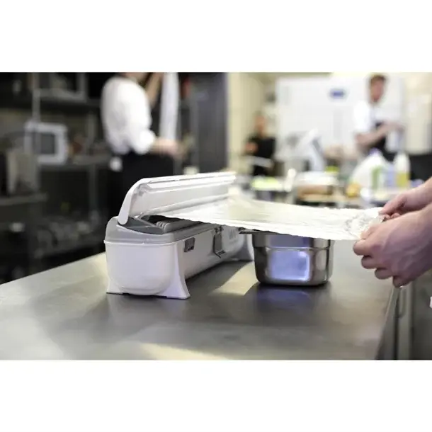 Distributeur de film alimentaire Wrapmaster utilisé avec une recharge de papier aluminium